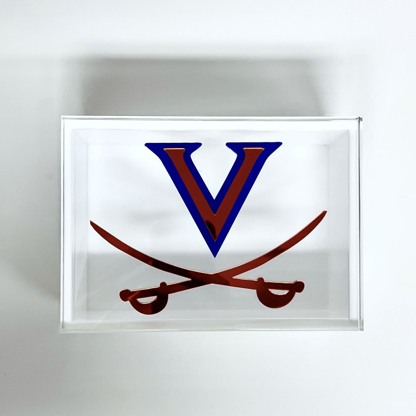 Decorative wall art with a blue 'V' and crossed swords